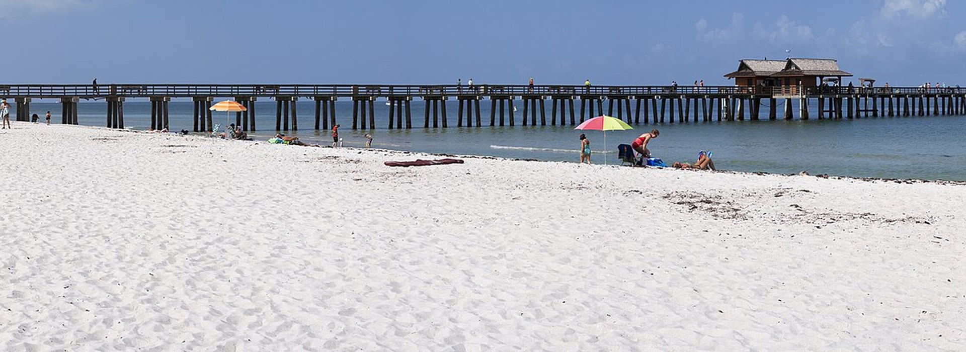 A quiet Naples beach at sunset during the off-season