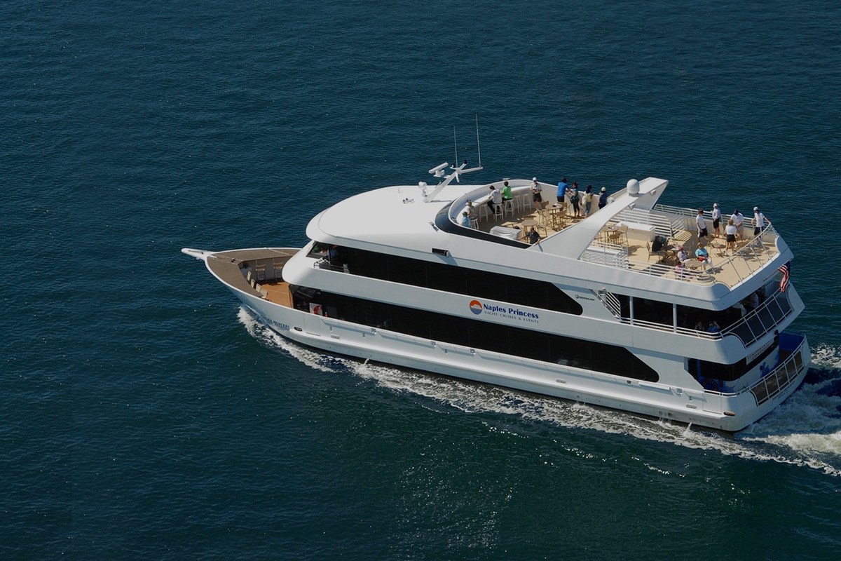 A sightseeing cruise on the water at sunset off Naples